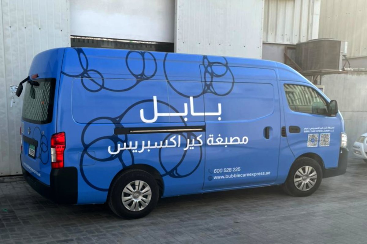 Bubble Care Express Laundry full van branding with a custom blue bubble design in Abu Dhabi
